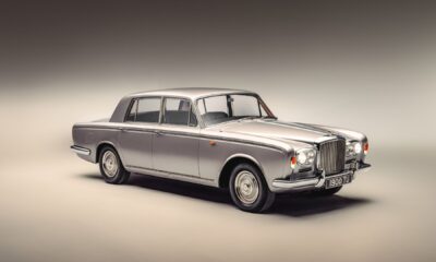 front three-quarter shot of a Bentley T Series parked indoors under studio lighting.