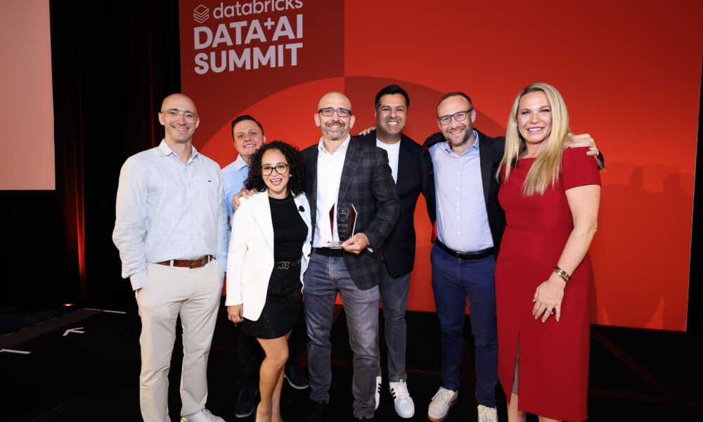 A group shot of of AVEVA team being recognized as the 2025 Databricks Manufacturing ISV Partner of the Year