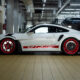 A side-angle shot of a 992 generation Porsche 911 GT3 RS equipped with the Manthey Performance kit