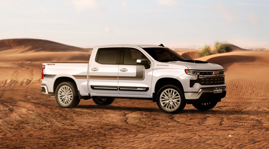 A side-angle shot of a Chevy Silverado parked in the desert.