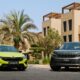 A front-angle shot of a Skoda Octavia RS and Skoda Kodiaq parked outdoors