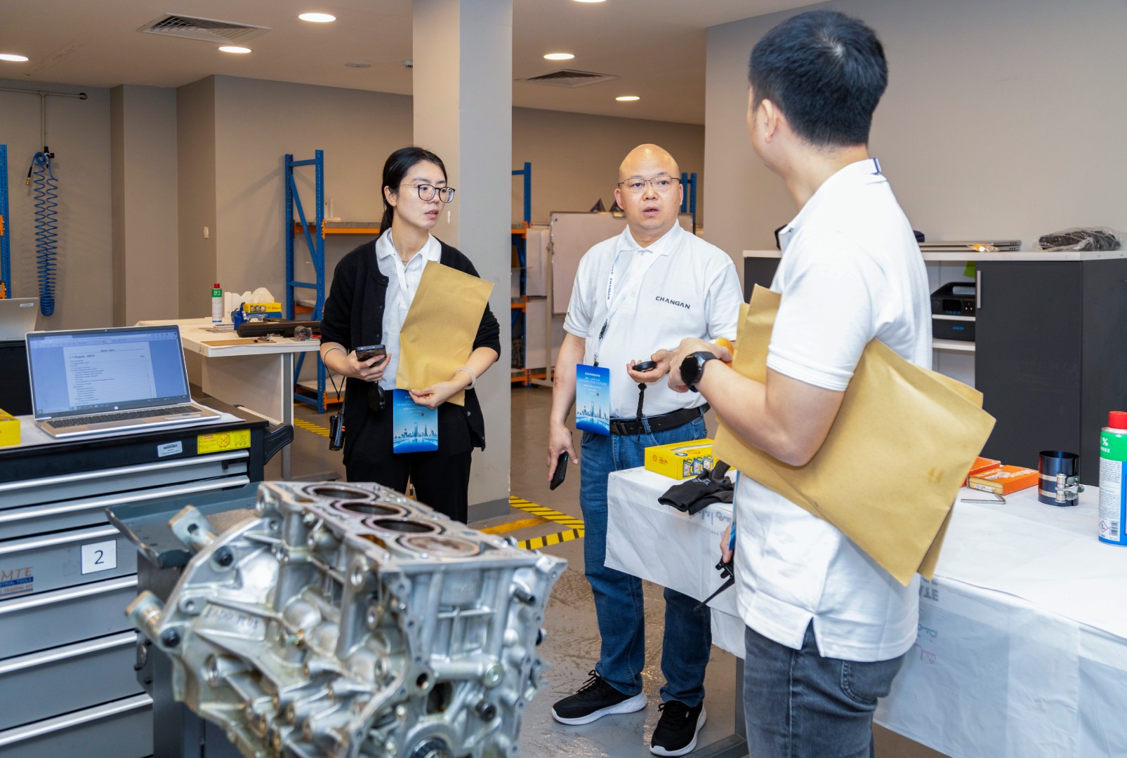a side-angle shot of automotive professionals attending a training session