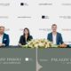Tissoli, Pininfarina, and Marjan executives signing AED 1.2 billion Palazzo Tissoli partnership agreement at formal ceremony with branded backdrop.