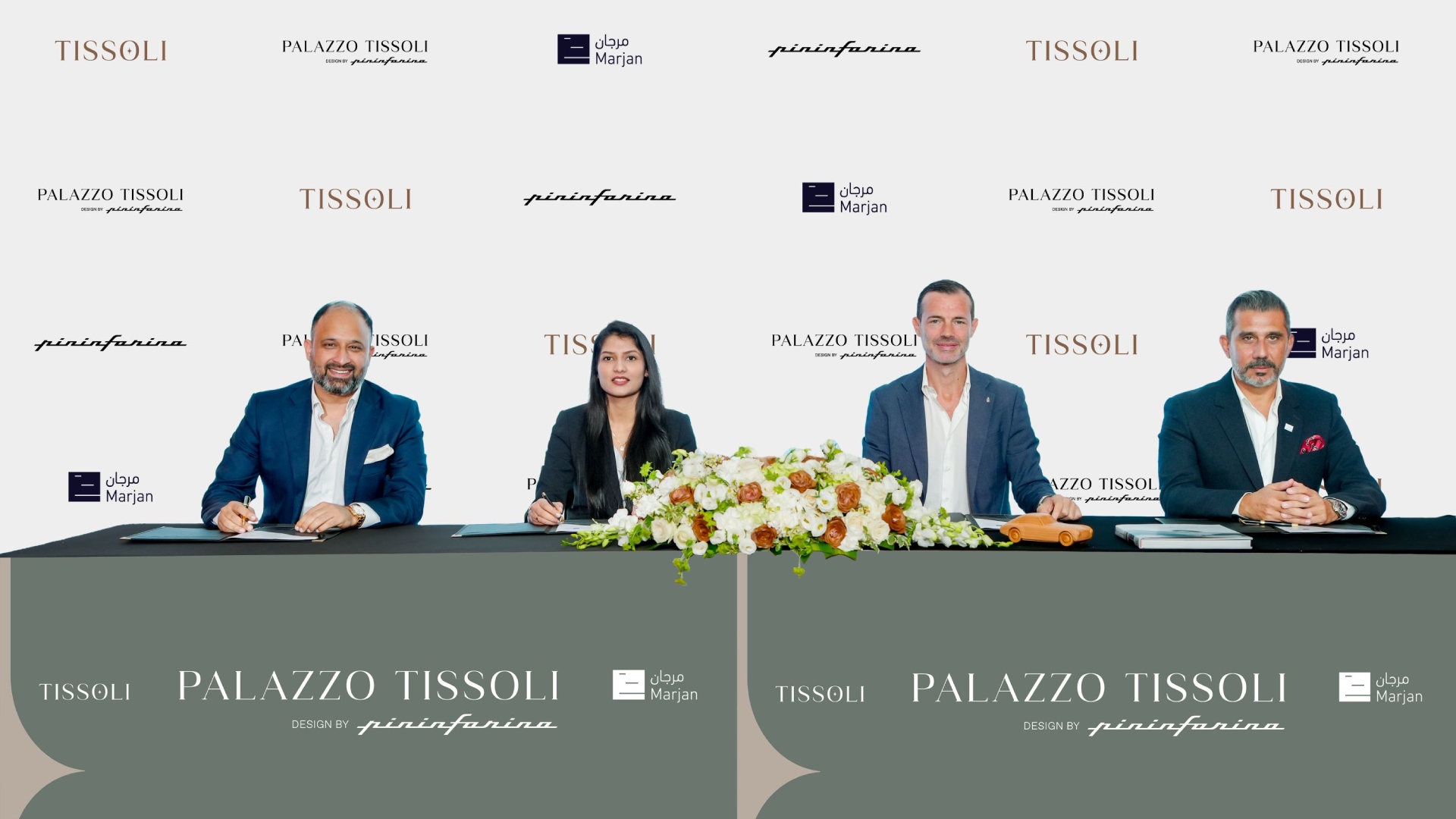 Tissoli, Pininfarina, and Marjan executives signing AED 1.2 billion Palazzo Tissoli partnership agreement at formal ceremony with branded backdrop.