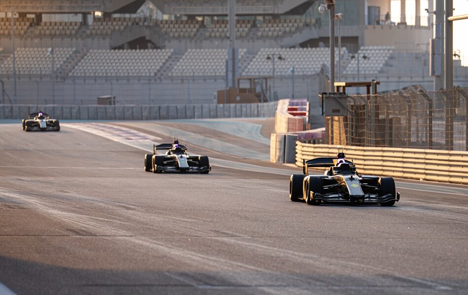 action shot of cars racing on the track at the Abu Dhabi Autonomous Racing League