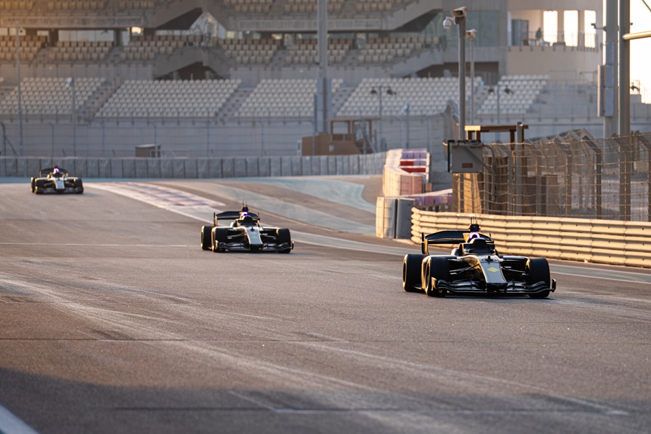 action shot of cars racing on the track at the Abu Dhabi Autonomous Racing League
