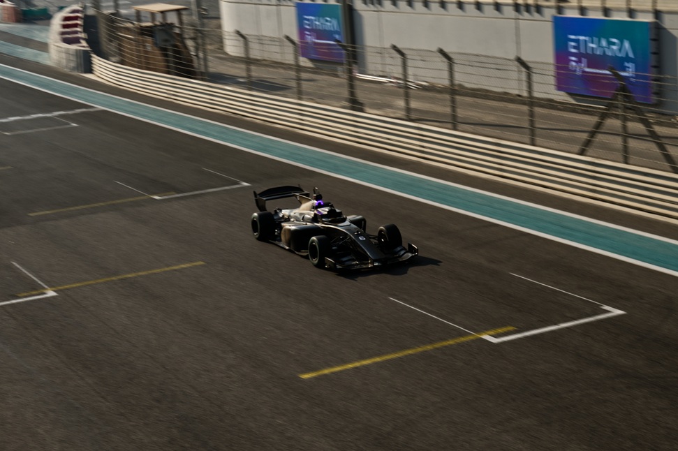 action shot of cars racing on the track at the Abu Dhabi Autonomous Racing League