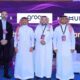 Ayman Hamdan, Co-founder of Unifonic and others from Unifonic on the stage at an event