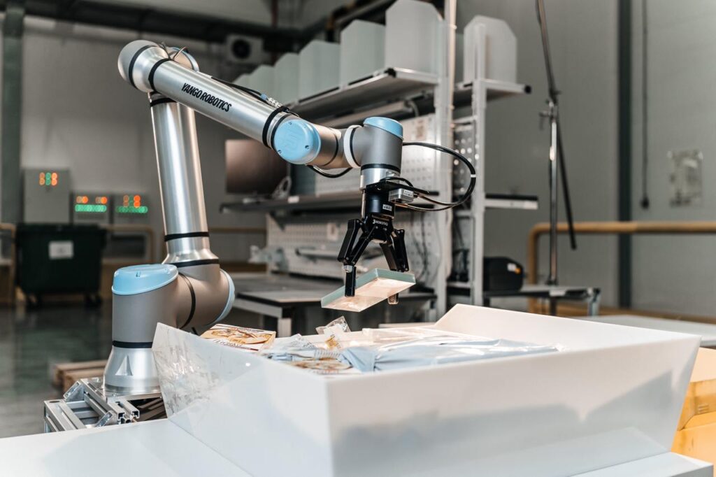 A wide angle shot of a robotic arm by Yango Tech in an industrial setup