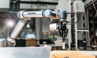 A wide angle shot of a robotic arm by Yango Tech in an industrial setup