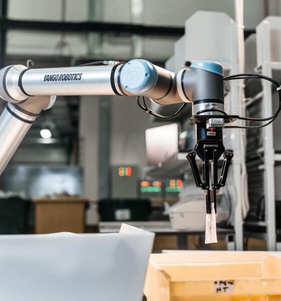 A wide angle shot of a robotic arm by Yango Tech in an industrial setup