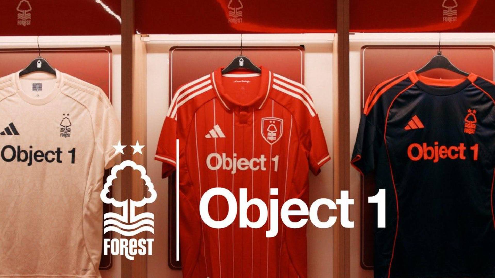 Object 1 branded Nottingham Forest football jerseys displayed on hangers - white away kit, red home kit, and black goalkeeper kit with Forest club logo