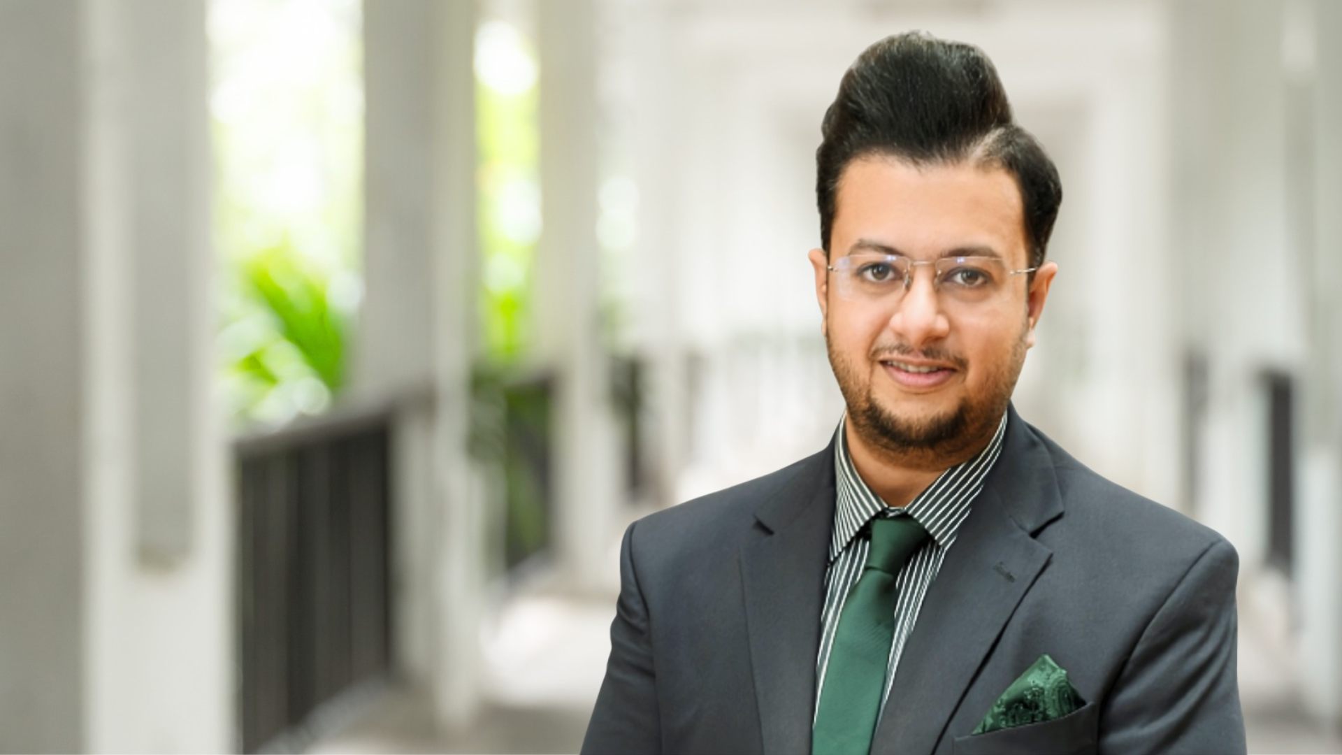 Dr. Sreejit Chakrabarty, Group Head of Technology, AI & Innovation at Fortes Education, in professional attire at the Dubai office.Retry