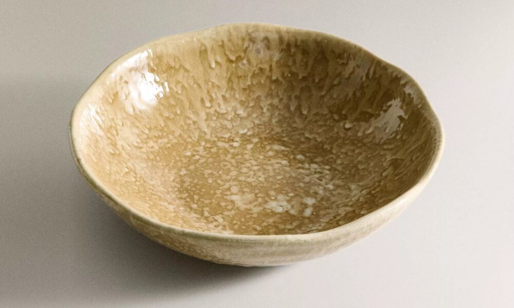 Handcrafted ceramic bowl with speckled earthy glaze finish from Zara Home Autumn Winter 2025 collection.