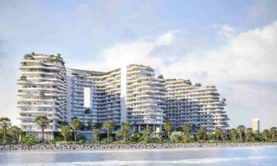 Miraggio luxury waterfront development by Source of Fate on Al Marjan Island, Ras Al Khaimah, featuring curved architecture with landscaped terraces and beachfront access.