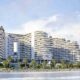 Miraggio luxury waterfront development by Source of Fate on Al Marjan Island, Ras Al Khaimah, featuring curved architecture with landscaped terraces and beachfront access.