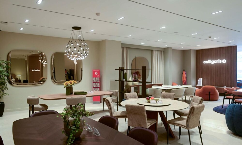 western furniture and Calligaris furniture showroom with modern dining tables, chairs, and decorative mirrors