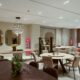 western furniture and Calligaris furniture showroom with modern dining tables, chairs, and decorative mirrors