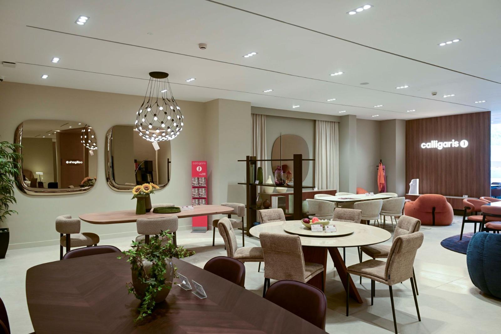 western furniture and Calligaris furniture showroom with modern dining tables, chairs, and decorative mirrors