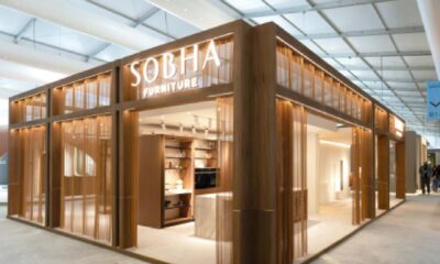 Sobha Furniture exhibition booth with wooden facade and illuminated display at design trade show