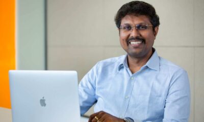 Alt Text: Manikandan Thangaraj, Vice President of ManageEngine, working at laptop in office setting