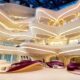 Luxury shopping mall interior with curved LED lighting, multi-level atrium, and purple velvet seating areas