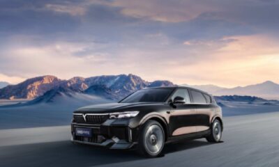 VOYAH Free electric SUV driving through desert landscape with mountains at sunset