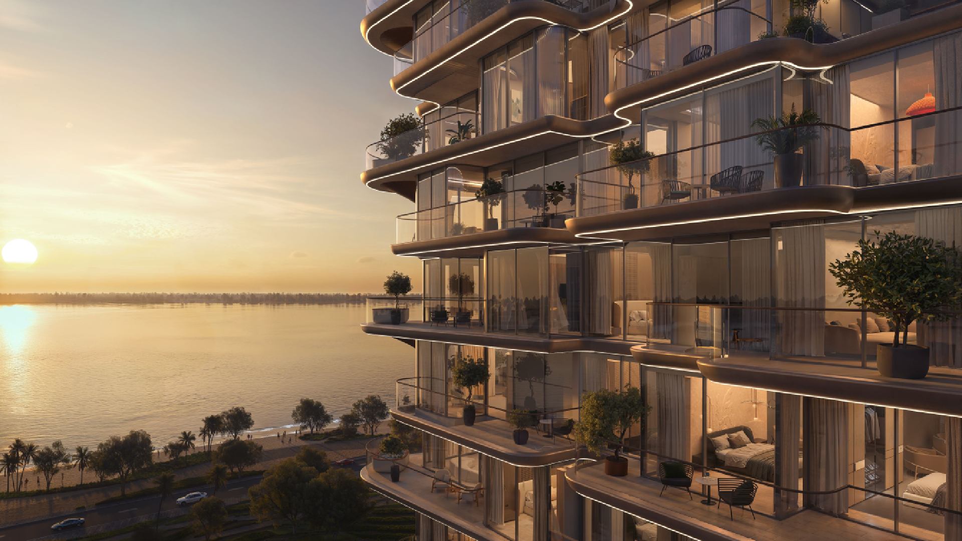 Treppan Serenique Residences exterior view showing modern dual tower design with curved balconies and waterfront location at sunset