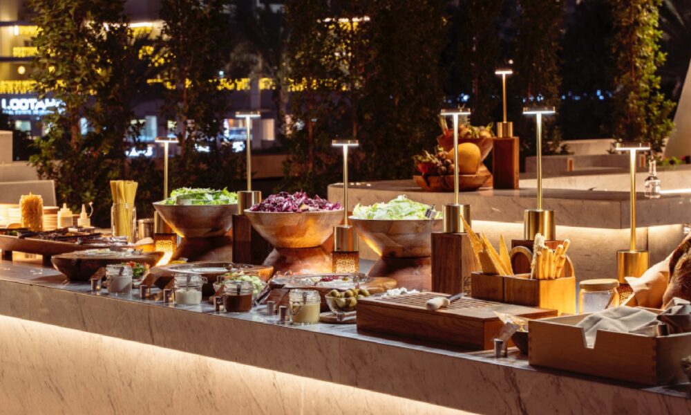Grill by ME outdoor buffet station at ME by Meliá Dubai with fresh salads, grills, and interactive dining setup at poolside terrace