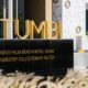 Tumbi restaurant golden signage at West Palm Beach Hotel Dubai, Tapestry Collection by Hilton entrance