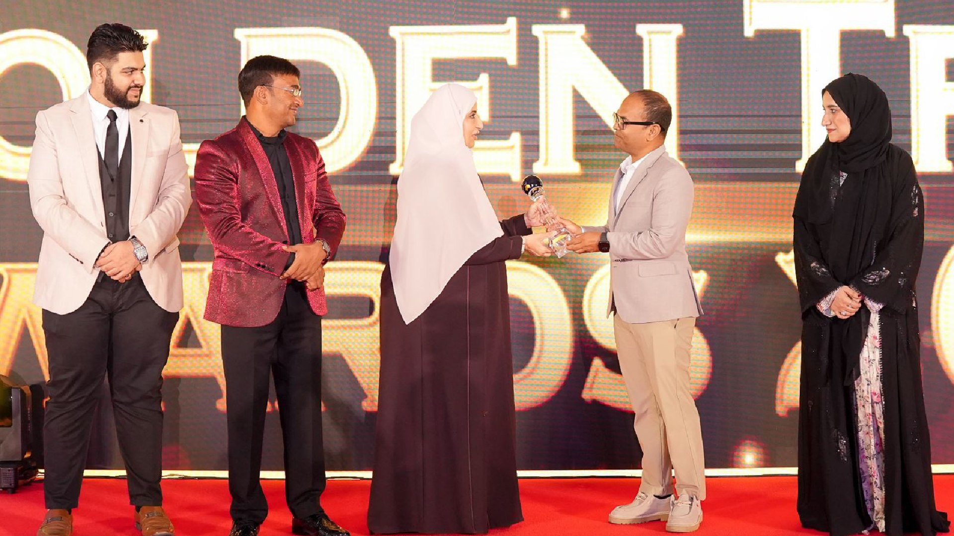 Masdhooq Saeed receiving World GM Awards 2025 trophy on stage at hospitality awards ceremony