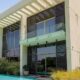 Modern sustainable villa with glass balconies, energy-efficient design, and pool in Dubai