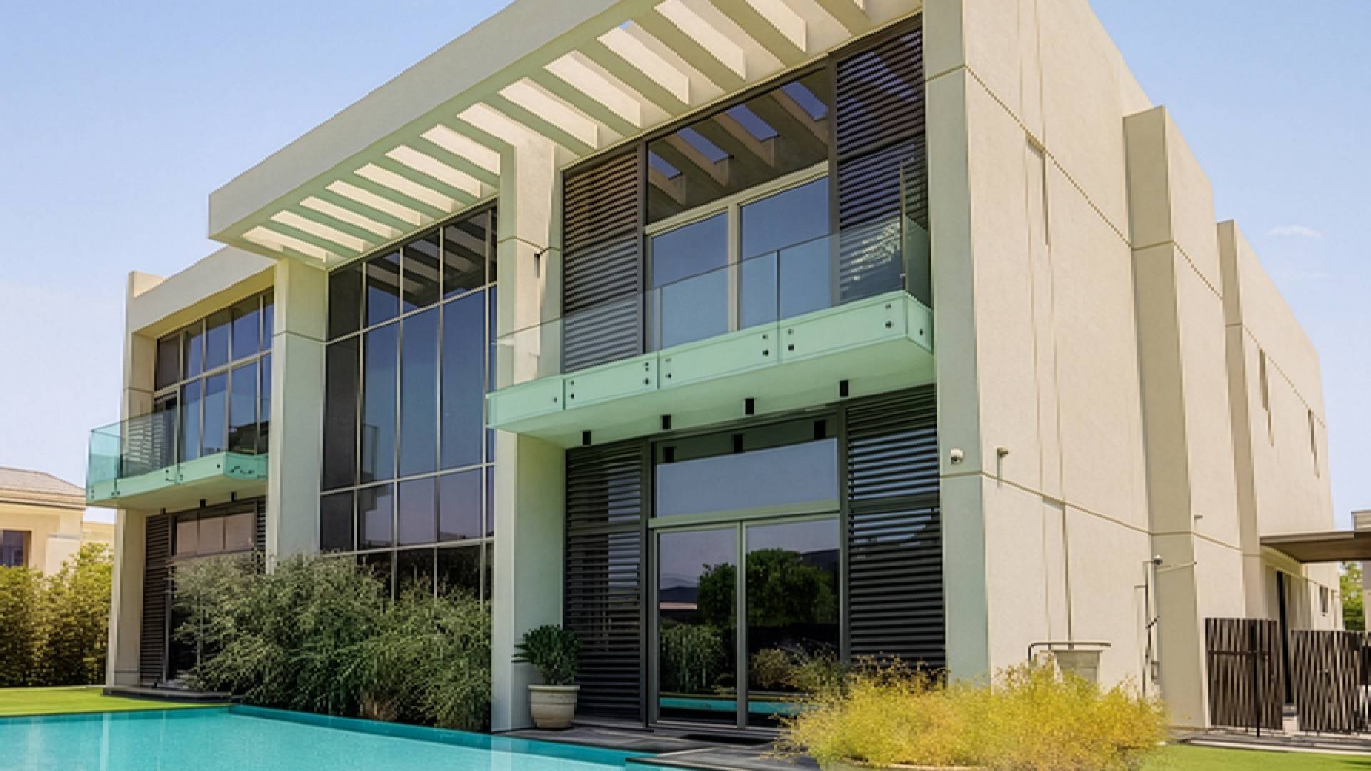 Modern sustainable villa with glass balconies, energy-efficient design, and pool in Dubai