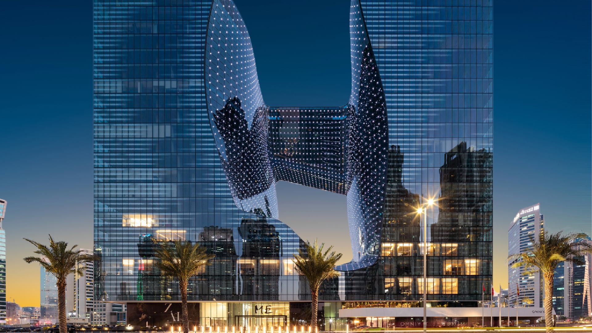 ME Dubai hotel illuminated at dusk with Michelin Guide 2025 logo overlay