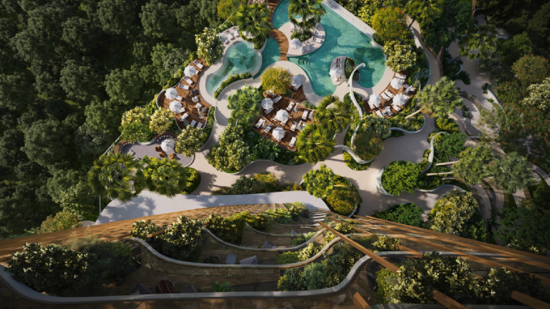 An aerial rendering shows a lush, green residential complex surrounded by forest, featuring terraced balconies covered in plants and a large, free-form swimming pool with sunbeds and white umbrellas.