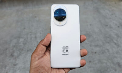 A person holding the Huawei Nova 14 Pro's white back, centered, highlighting the camera module and Huawei/XMAGE branding.