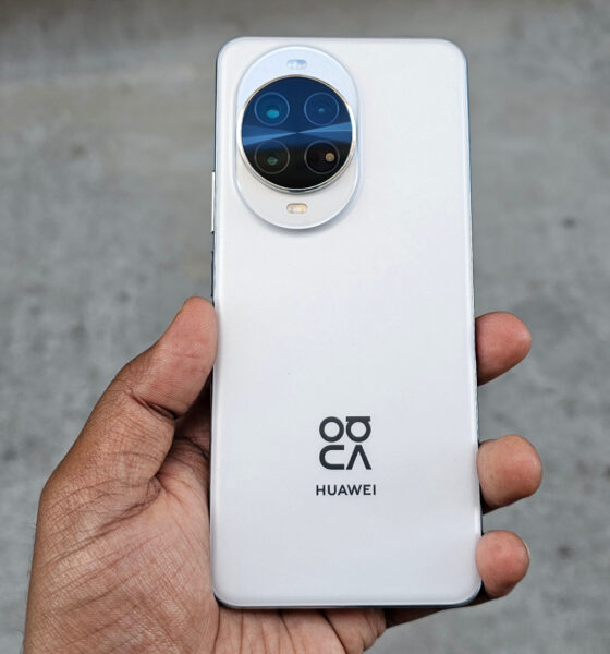 A person holding the Huawei Nova 14 Pro's white back, centered, highlighting the camera module and Huawei/XMAGE branding.