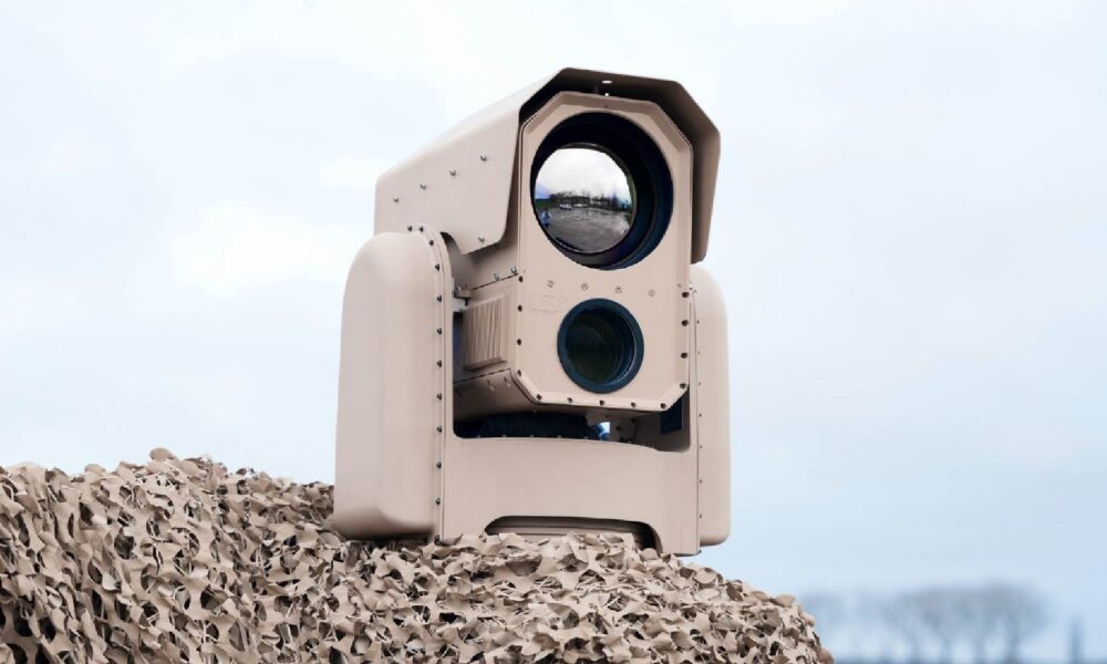 A close-up view of ATERMES' SURICATE AI-enabled multi-sensor surveillance camera system, featuring an optical lens and sensor housing.