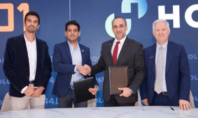 Representatives from HOLCIM, 44.01, and partners shaking hands to seal the CO₂ mineralisation pilot project agreement at the Fujairah cement plant site.