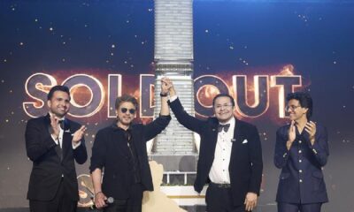 Bollywood superstar Shah Rukh Khan and Danube Group Chairman Rizwan Sajan shaking hands on stage at the launch event of the SHAHRUKHZ by Danube commercial tower in Dubai.