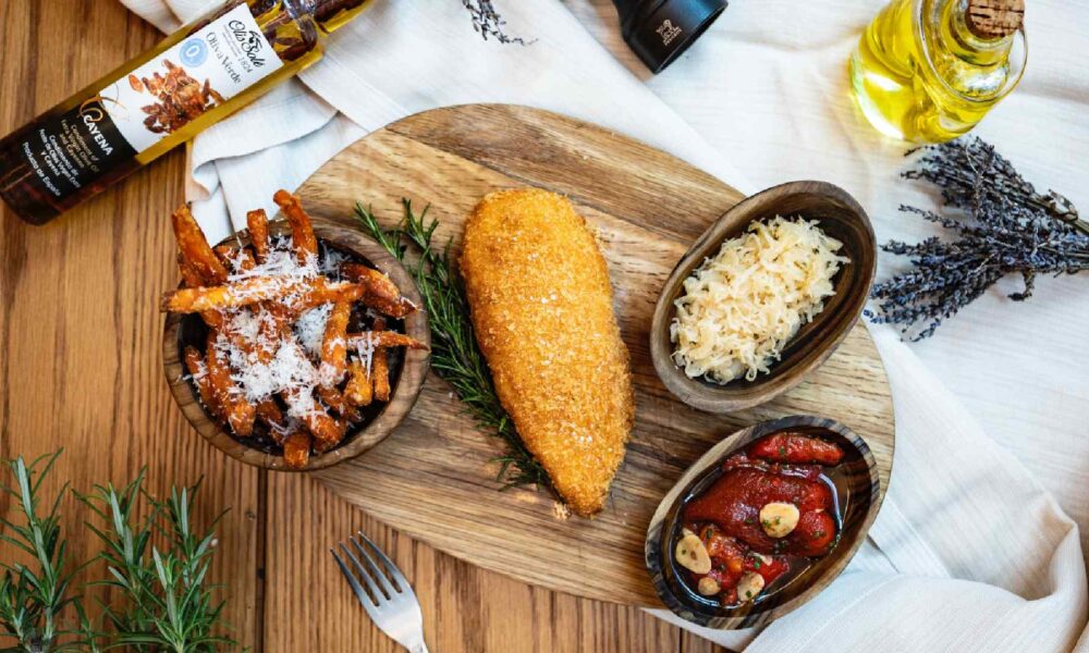 A beautifully plated festive turkey or roast chicken dish, carved and served with roasted root vegetables, herbs, and gravy, likely from Central Restaurant at MELIÁ DUBAI