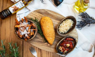 A beautifully plated festive turkey or roast chicken dish, carved and served with roasted root vegetables, herbs, and gravy, likely from Central Restaurant at MELIÁ DUBAI