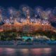 Spectacular white fireworks exploding over the Atlantis, The Palm hotel and resort building at night.