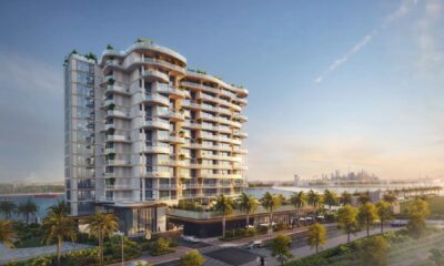 Architectural rendering of the CASAGRAND Hermina residential tower on Dubai Islands, showcasing the modern, stepped structure, waterfront pools, and luxury amenities overlooking the sea