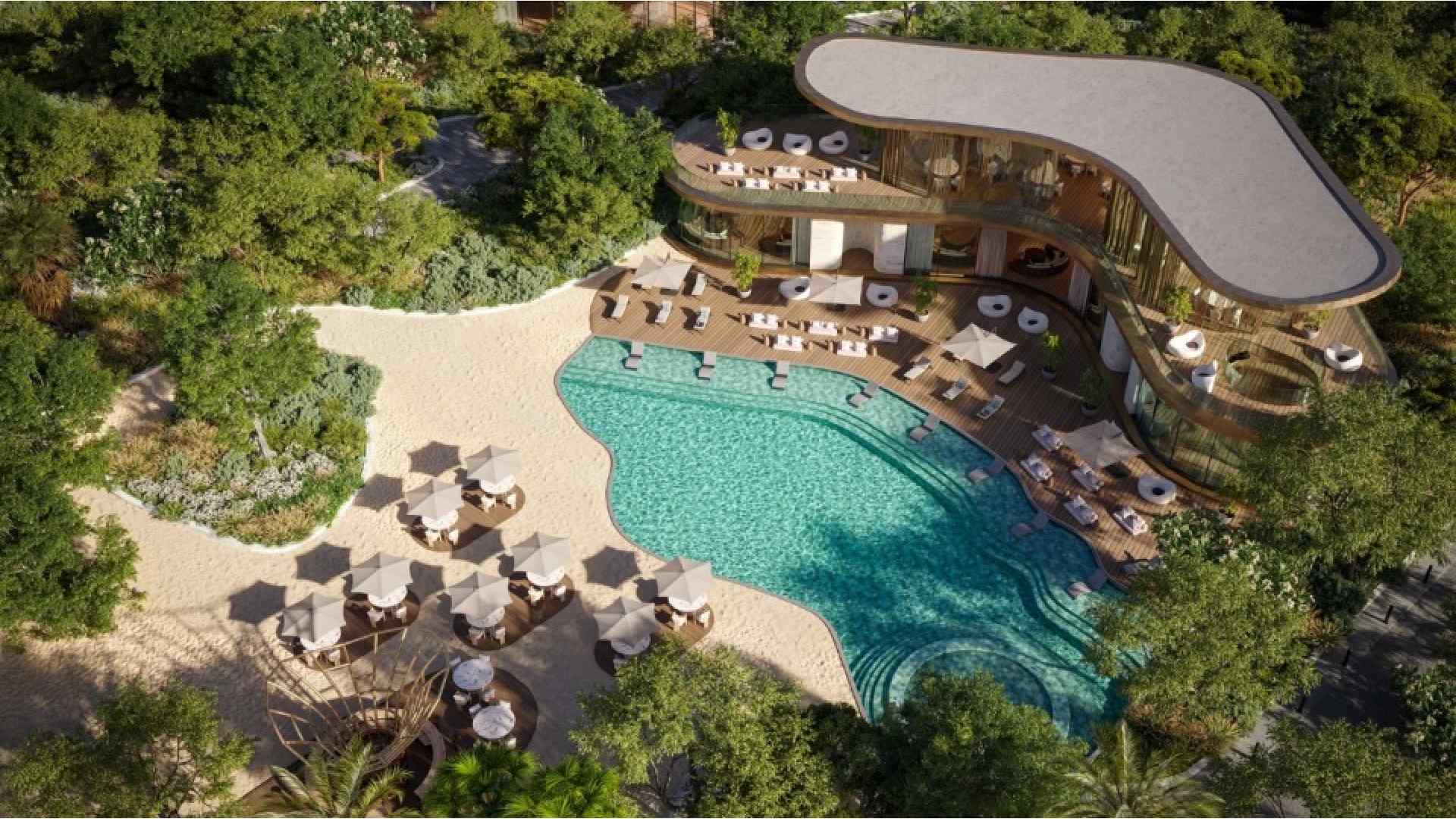 An aerial architectural rendering of SIORA by BEYOND Developments on Dubai Islands, highlighting the curved residential buildings, extensive green landscaping, and the continuous 6km coastline and beach