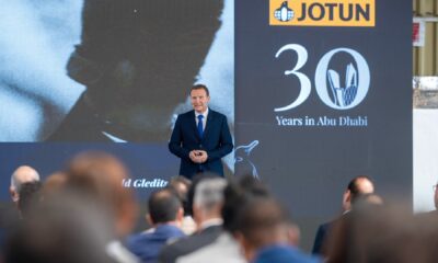 The new, state-of-the-art Jotun Abu Dhabi manufacturing facility building under a blue sky.