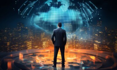 a man in formal suit looking out to the globe