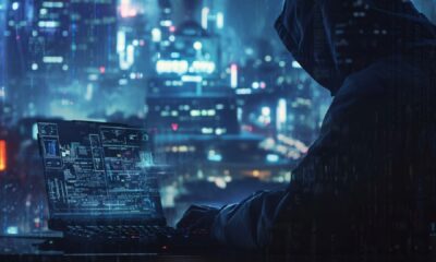 A close-up photograph of a computer screen displaying a digital bank transfer receipt with sensitive personal information, including account numbers and transaction details.