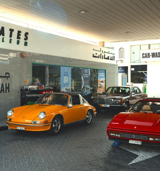 Classic cars at an Emirates Petroleum Jumeirah gas station.