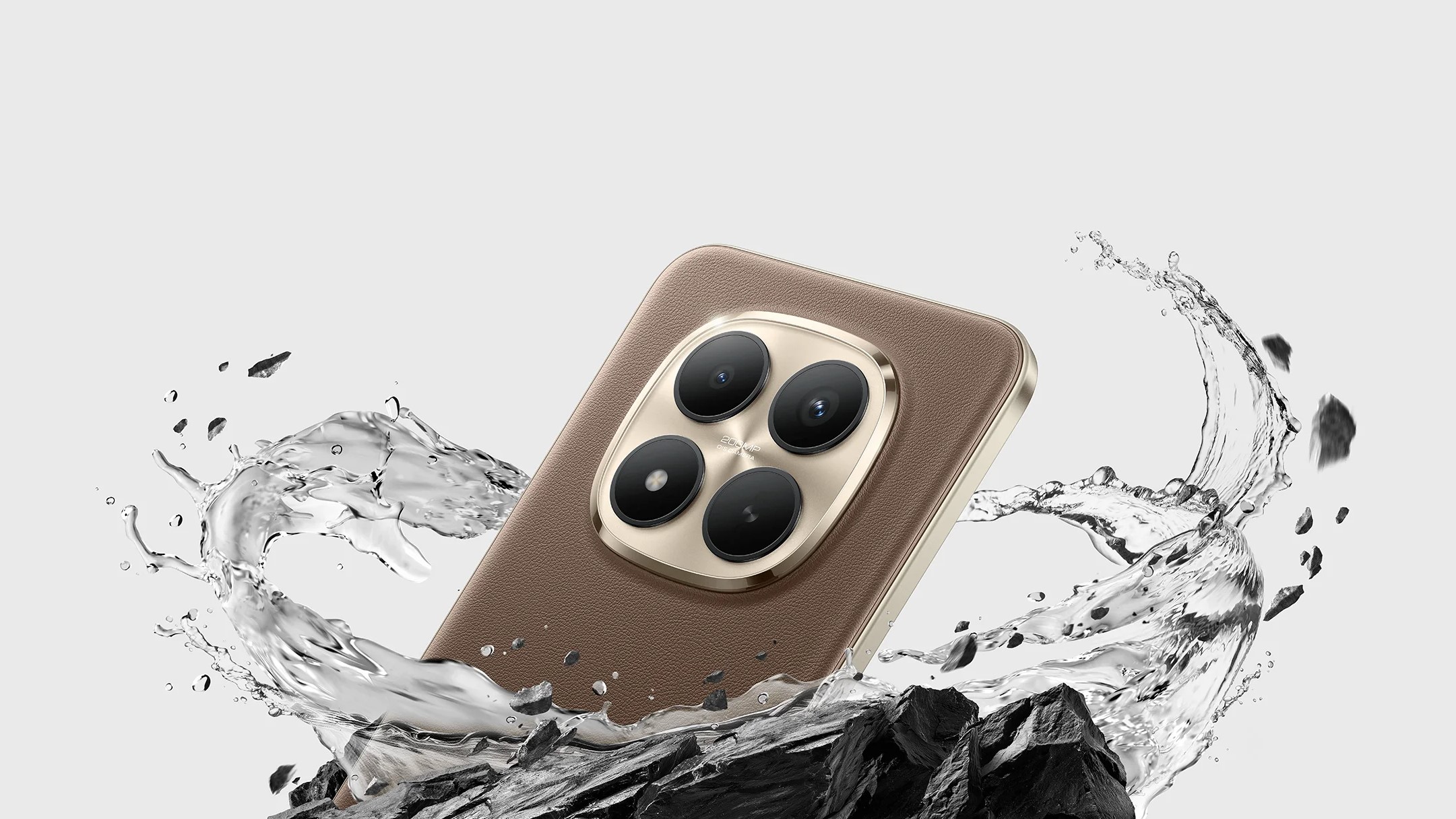 Official promotional image of the Xiaomi Redmi Note 15 Pro+ in Mocha Brown. The phone features a premium eco-leather back and a large circular gold-rimmed quad-camera module. It is shown dramatically splashing through water and dark jagged rocks to highlight its IP69K water resistance and Titan Durability.